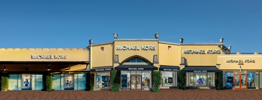 Michael Kors Store at Citadel Mall, CA.  Stitch Panorama. Several head-on daytime views of the multiple elevations combined with windows photographed at night